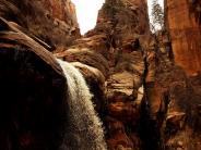 Tall Rocks with a waterfall flowing